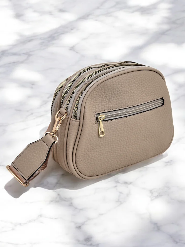 Royalfashion Oválny malý dámsky kabelka vyrobená z eko-kože