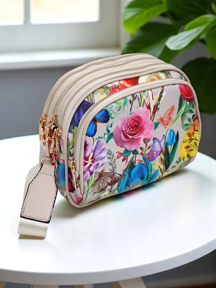 Royalfashion Kvetinová oválna malá dámska kabelka z eko-kože